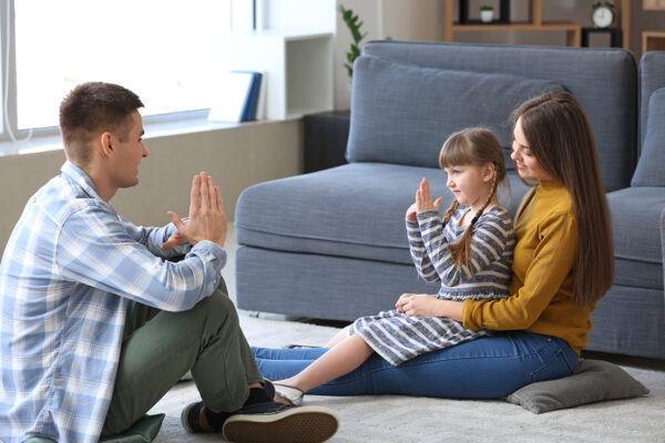 Deaf mute family using sign language at home